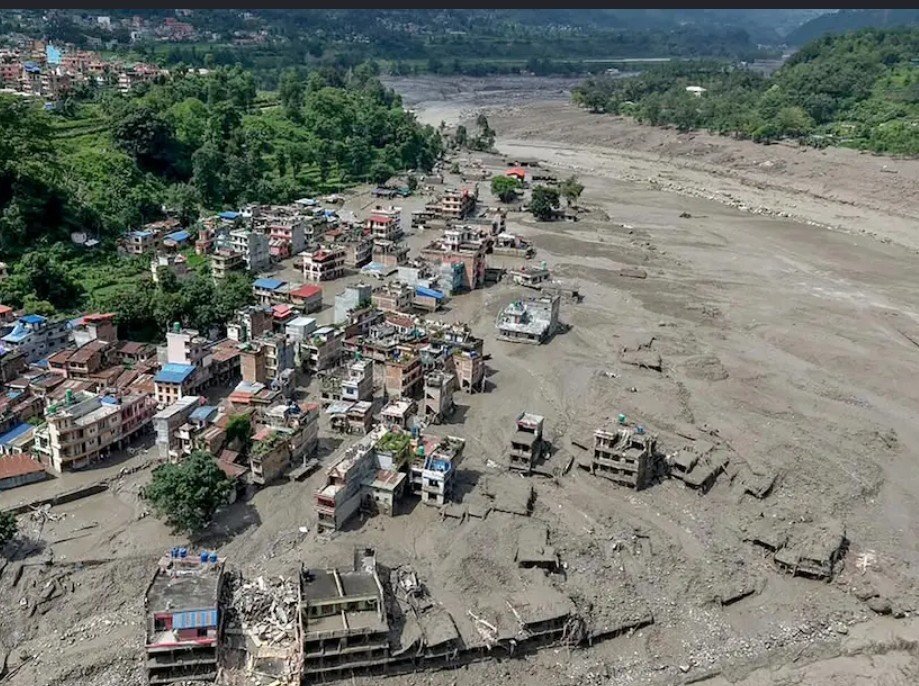 Houses are in danger of falling into the muddy Trishuli River after big floods in Nepal on August 26, 2026.